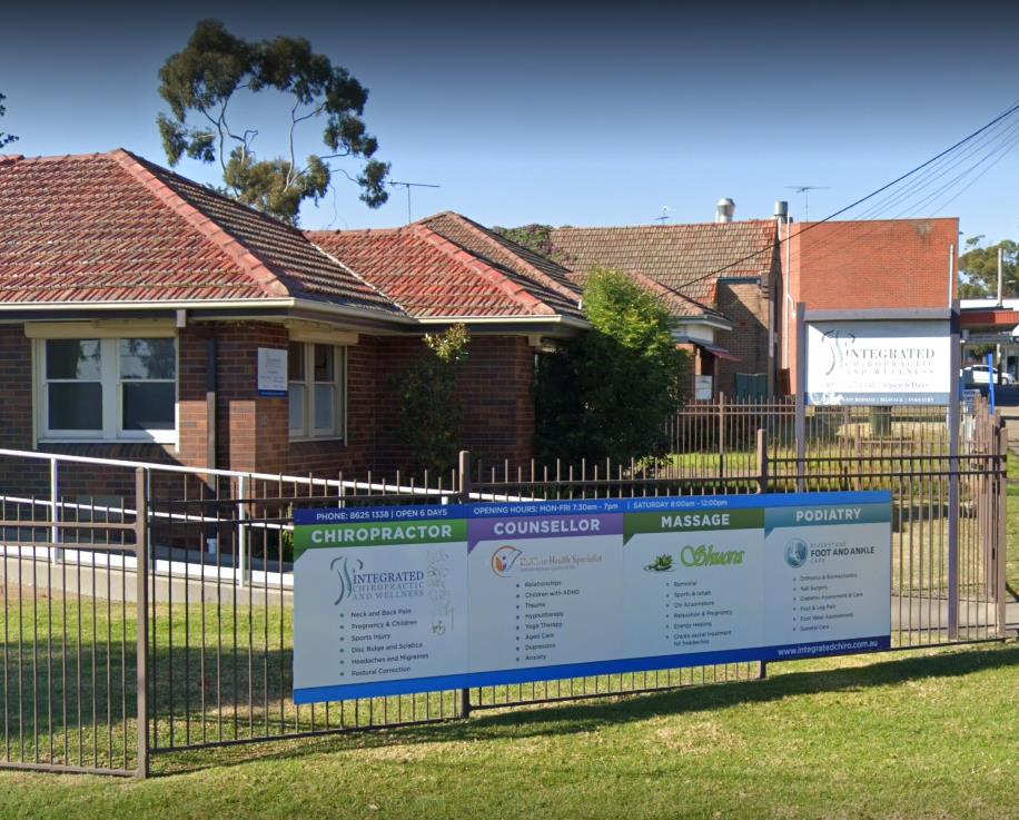 Brick chiropractic and wellness clinic with signage